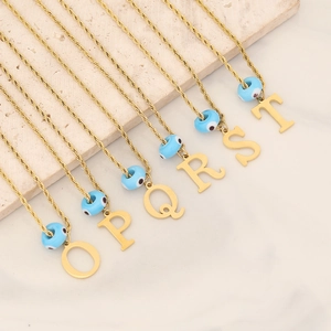 Gold plated twisted chain necklaces with blue evil eye beads and initial letter pendants