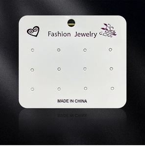 Detailed view of 8x7cm white jewelry display card for earrings and necklaces