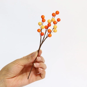 Artificial orange and yellow berry stems for Christmas and holiday vase decorations