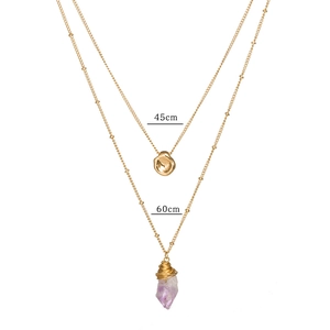 Detail of double-layer gold necklace with natural amethyst and lava disc 45cm 60cm