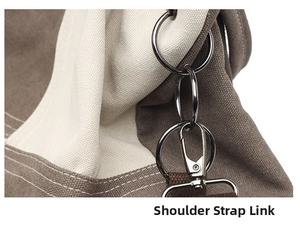 Detail of canvas tote bag showing metal ring and removable shoulder strap hook