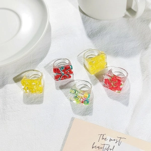 Five-piece acrylic ring set featuring cute fruit slices like strawberry and kiwi