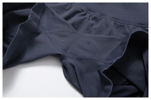 Detail of grey seamless yoga shorts showing reinforced diamond gusset and ribbed texture