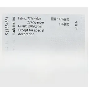 Detail of care label showing S size 77% Nylon fabric and washing instructions