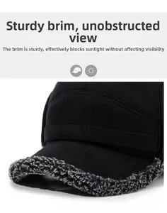 Macro detail of the gray faux shearling brim on a black winter trapper hat for men