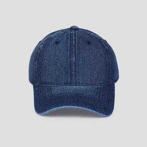Detail of blue washed denim baseball cap with reinforced stitching on the brim