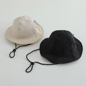 Detail of quick-dry nylon sun hats with adjustable windproof cords and side embroidery