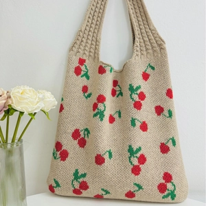 Knit tote bag with cherry pattern and wide shoulder strap for casual daily use