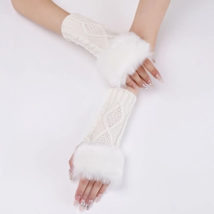 Detail of cream cable-knit fingerless gloves with plush faux fur trim and diamond pattern