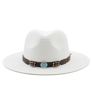 Detail of white straw Panama hat with bohemian faux-leather band and blue stone bead