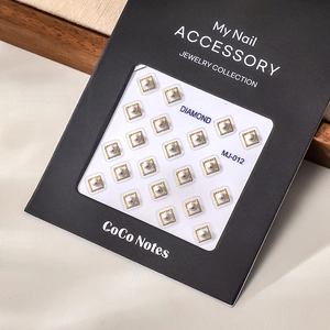 Detail view of MJ-012 white pearl nail art studs with elegant gold square frames