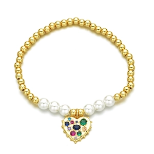 Beaded gold bracelet with white pearls and a colorful gemstone heart pendant charm