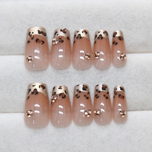 French leopard print press-on nails with glitter ombre and sparkling rhinestones