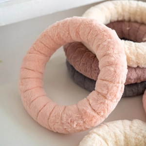Handmade Christmas wool felt wreath in multiple pastel colors for cozy home decoration