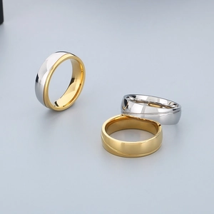 Polished minimalist stainless steel rings with gold plating and diagonal groove detail