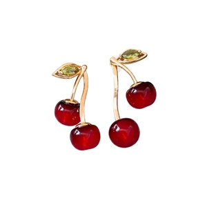 Elegant cherry drop earrings with red resin fruit and green zircon leaves in gold finish