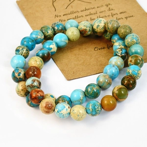 Bohemian imperial stone beaded bracelet set for couples with card on white background