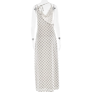 Macro shot of white polka dot dress showing back lace-up details and chiffon fabric