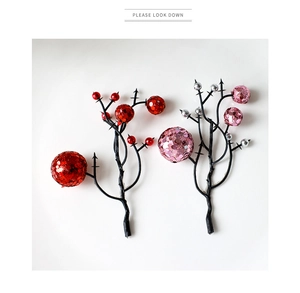 Close-up of red and pink glitter berry stems for Christmas wreaths and holiday decor