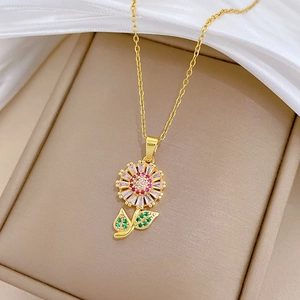 Detailed macro view of a colorful sunflower zircon pendant on a gold titanium steel necklace