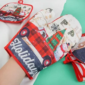 Christmas kitchen set with beige heat resistant gloves and pad featuring holiday truck