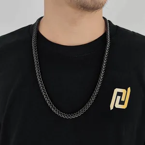 Close-up of 6mm matte black stainless steel Cuban link chain necklace on a male model