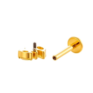 Titanium piercing jewelry with gold finish and sparkling zircon stud on white background