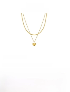 Detail of double-layer titanium steel necklace with heart pendant and 18K gold plating