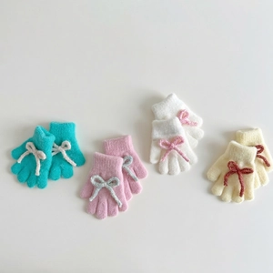 Kids warm knit gloves with cute bow decor in blue, pink, white, and beige colors