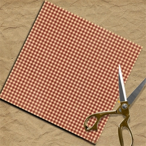 Close-up of red and white plaid craft paper with vintage metal scissors on brown kraft paper