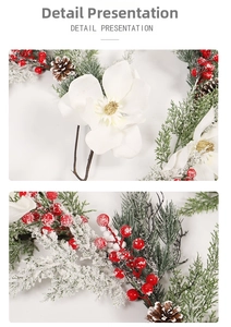 Détail de fleurs de magnolia blanc et pommes de pin enneigées sur guirlande de Noël