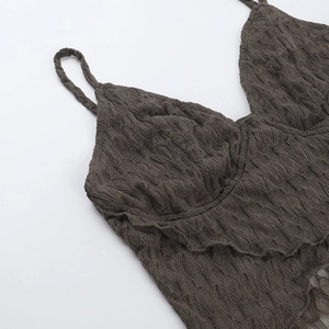 Close-up of dark brown knit tank top featuring textured V-neck lace detail and ribbed pattern