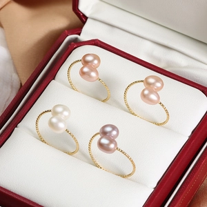 Adjustable gold open ring featuring two teardrop freshwater pearls in various colors