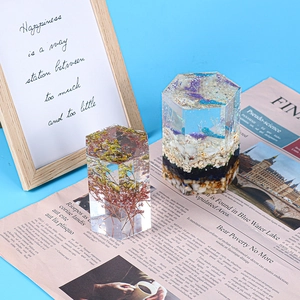 Detail of hexagonal resin mold art with dried flowers and ocean scene on wooden frame