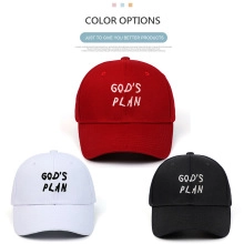 Detailed close-up of God's Plan embroidery on red, white, and black cotton baseball caps