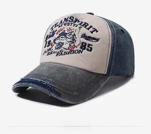 Macro shot of embroidered wolf head patch and distressed denim bill on baseball cap