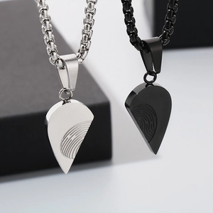 Couples heart pendant necklace with fingerprint pattern in black and silver steel
