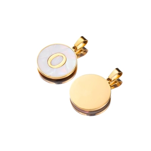 Macro view of gold stainless steel 22mm shell pendant with letter O and smooth back