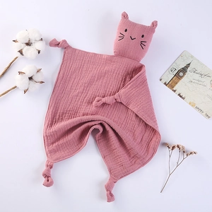 Detailed view of pink muslin cotton baby security blanket with cute cat head design
