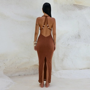 Detail of backless brown maxi dress featuring beaded halter neck and back slit detail