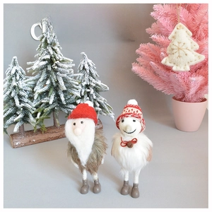 Handmade wool felt Santa and snowman figurines with knitted hats for Christmas decor