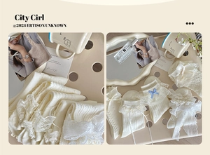 Close-up of white ballet-style lace socks with sweet bows on a warm aesthetic background