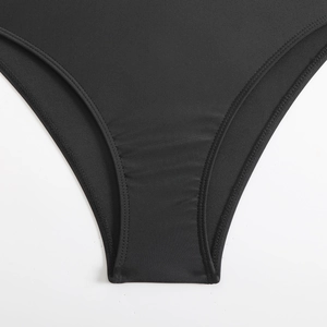 Detail of black swimsuit fabric with horizontal texture and reinforced double stitching