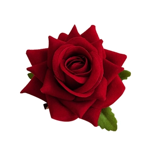 Elegant red velvet rose hair clip and brooch with green leaves on white background