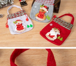 Detailed view of 3D Santa gift bags showing textured felt fabric and festive embroidery
