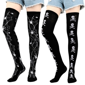 Detailed view of Halloween thigh high socks with skull and spider web patterns