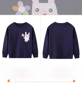 Detail of dark blue kids sweatshirt featuring embroidered bunny and flower cartoon