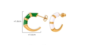 Detail view of C-shaped bamboo hoop earrings with green enamel and 1.8cm size markings