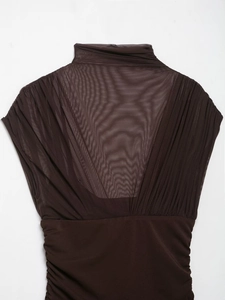Detailed back view of dark brown mesh splicing and pleated texture on high-neck dress