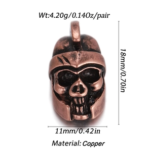 Macro shot of 18K gold plated copper skull beads with dimensions 18mm by 11mm